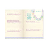Open book with text and decorative elements on a white background