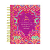 Colorful notebook with decorative patterns and motivational quote on a white background