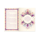 Open book with colorful mandala design and text on a white background