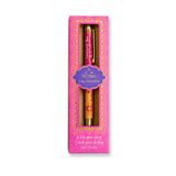 Decorative rollerball pen in a pink box with gold accents on a white background