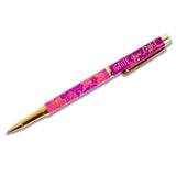 Pink pen with gold accents on a white background