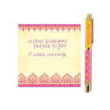 Notebook with decorative border and pen on a white background