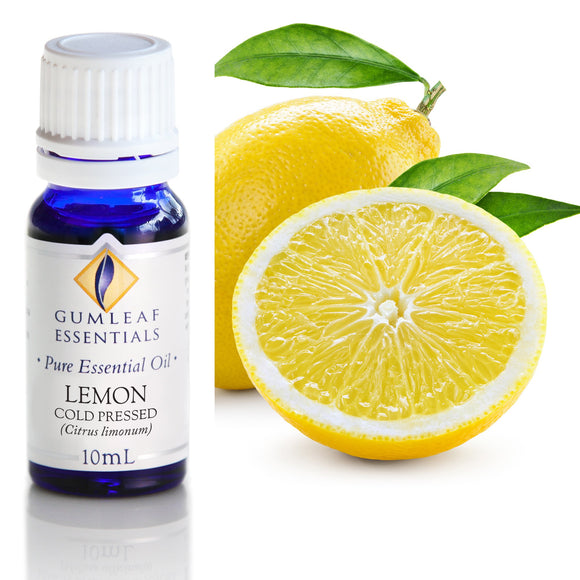 Bottle of Gumleaf Essentials Lemon essential oil with a sliced lemon and leaves on a white background