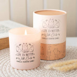 Vanilla scented candle with 'Life is better with cats' text and cat illustrations on a neutral background.