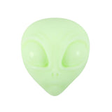 Light green alien face emoji on a white background