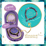 Purple jewelry case with mirror and bracelet, featuring semi-precious crystals and gold details.