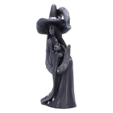 Statue of a witch with a black hat and long dress on a white background