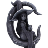 Black decorative figure of a witch with a broom and a cat on a white background