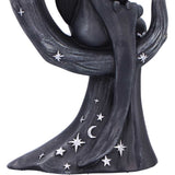 Statue of a woman with stars and a moon on her body against a white background