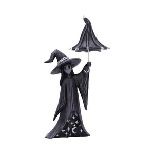 Black witch figurine with an umbrella on a white background