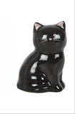 Black cat-shaped ceramic figurine on a white background