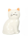 Ceramic cat-shaped figurine with orange ears on a white background
