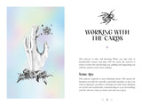 A printed card or booklet page with a pastel iridescent background, featuring a white illustrated hand with floral details, a small spider illustration, and the text 'WORKING WITH THE CARDS' plus a section titled 'Some tips'.