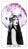 A tarot card illustration titled 'XVIII + THE MOON' showing a woman in profile with long dark hair, a patterned headpiece, and a large purple watercolor moon with white geometric lines behind her.
