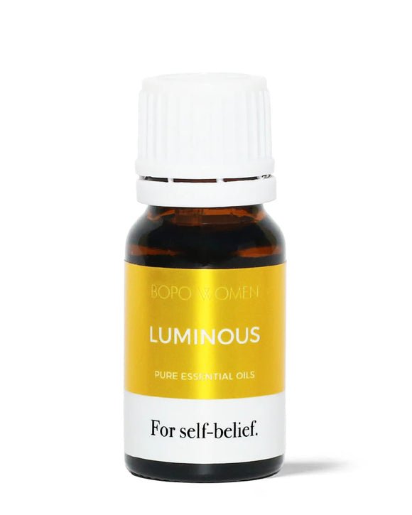 Bottle of Bopo Women Luminous pure essential oil on a white background