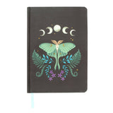 Notebook with a luna moth design on a dark background