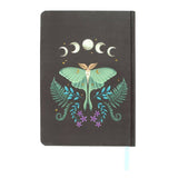 Notebook with a moth and moon phases design on a white background