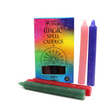 Magic spell candles with packaging on a white background