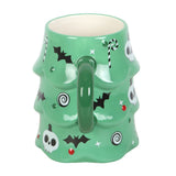 Green mug with Halloween-themed design on a white background