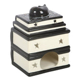 Decorative ceramic object with star patterns on a white background