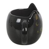 Black cat-shaped mug with gold designs on a white background