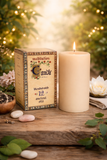 Meditation candle with packaging on a wooden surface with decorative elements