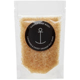 Packaged salt scrub with 'Summer Salt Body' label on a white background