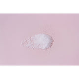 White powder on a pink background