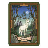 Tarot card featuring a white hart in a forest with a castle in the background