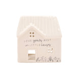 House-shaped light with 'Love grows best in little houses' text on a white background