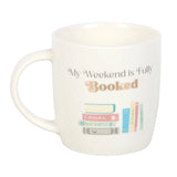 White mug with 'My Weekend is Fully Booked' text and book illustrations on a white background