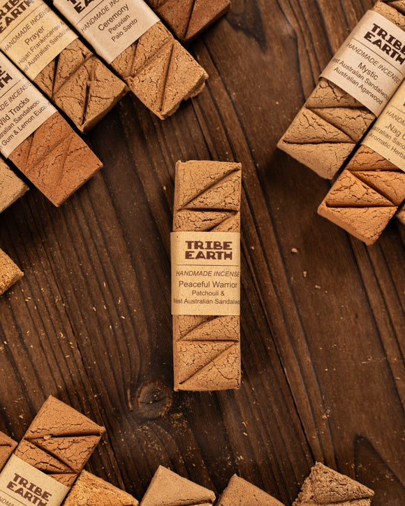 Tribe Earth incense sticks on a wooden surface