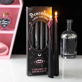 Draculina Vampire Tears Candles packaging with lit candles on a white surface.