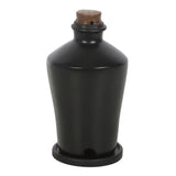Black ceramic bottle with a brown cap on a white background