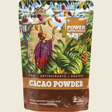 Package of Power Super Foods Cacao Powder with tropical design and person in traditional clothing.