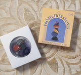 Set of protection stones in a box with packaging on a decorative surface
