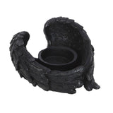 Black dragon-shaped candle holder on a white background