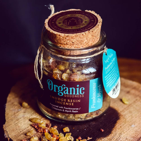 Jar of Organic Goodness incense with a cork lid on a wooden surface