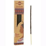 Incense stick with packaging featuring a face design and 'Sacred Elements' branding.