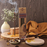 Sandalwood incense with packaging on a wooden surface with decorative elements.