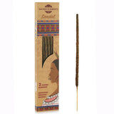 Sandalwood incense stick with packaging featuring a face design and 'Sacred Elements' branding.