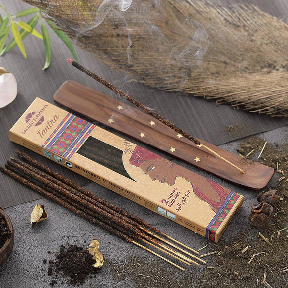 Incense sticks with packaging on a rustic background