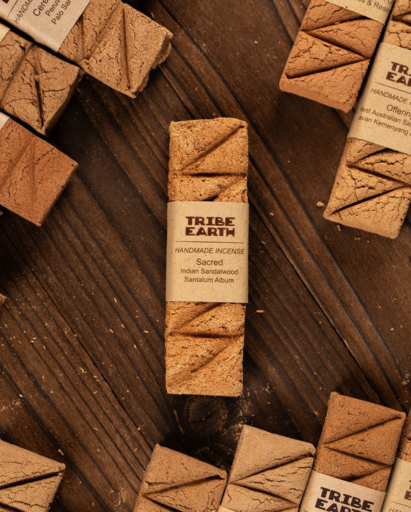 Tribe Earth incense sticks on a wooden surface