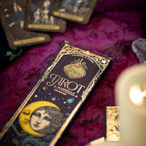 Tarot cards with a decorative box on a purple fabric background