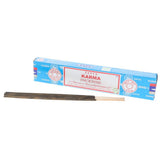 Box of Satya Karma incense sticks on a white background
