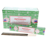 Satya Patchouli incense packaging with incense sticks on a white background