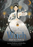 Book cover of 'Seasons of the Witch: Imbolc Oracle' with a witch in a white dress surrounded by candles and nature elements.