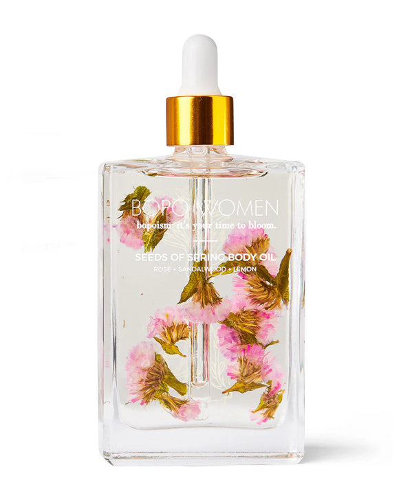 Bodily Women body oil bottle with floral design on a white background