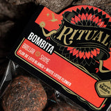 Ritual Bombita packaging with red and black design on a dark background