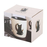 White mug with black cat design in a branded box